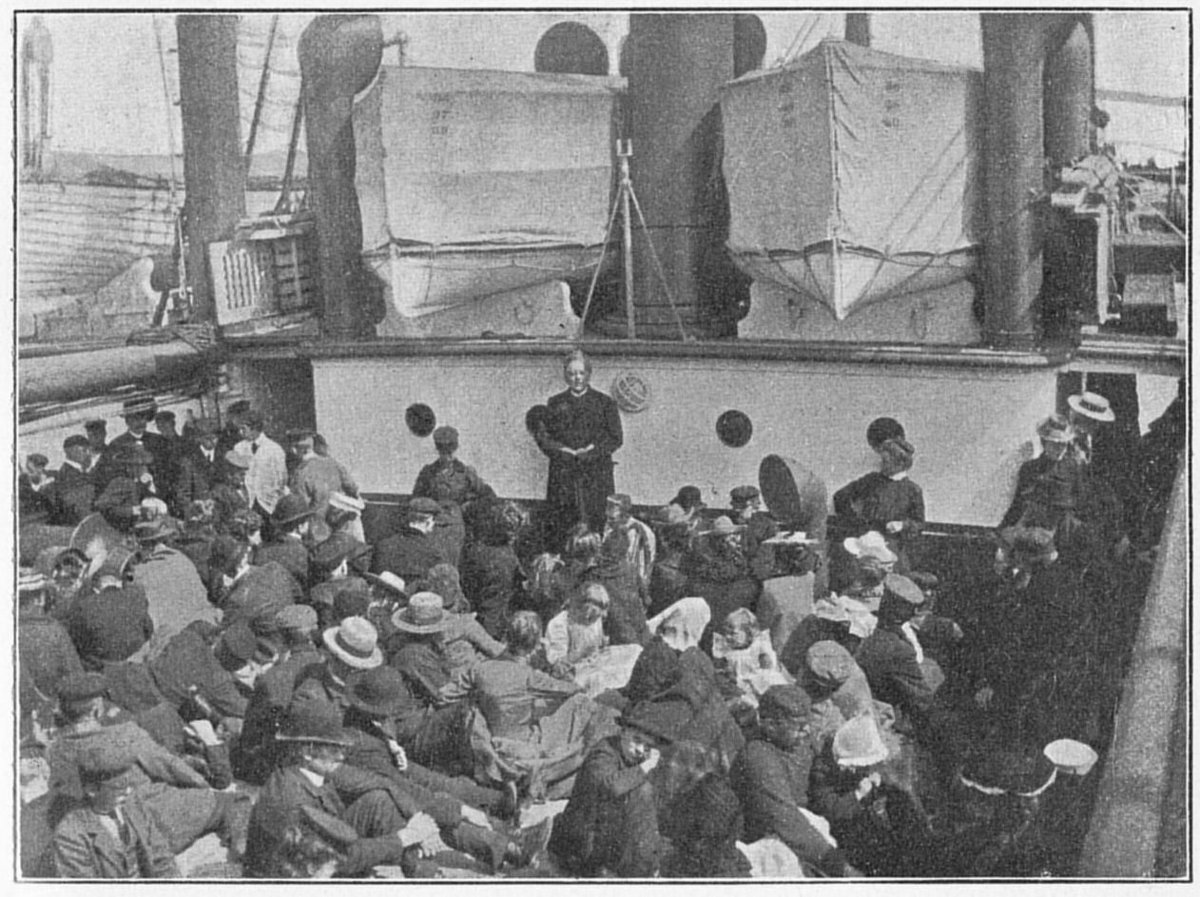 Emigrants crowding the deck of an Atlantic steamer while a pastor holds a service, lifeboats hanging overhead