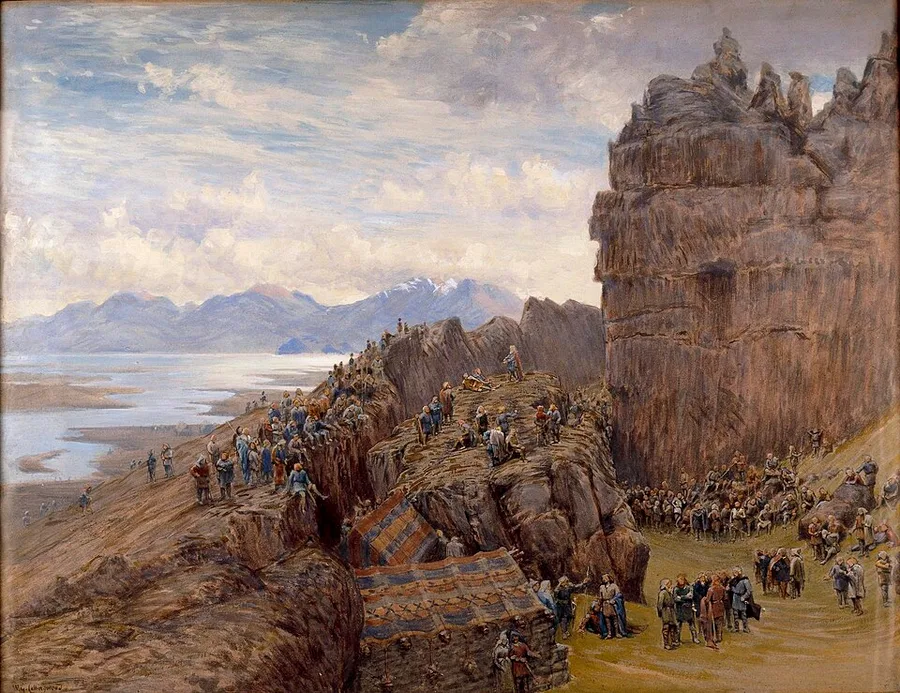 W.G. Collingwood's painting of the Althing in session at Þingvellir — chieftains ranged along the rift's rock ledges above the tented booths, the lake plain and fells beyond.