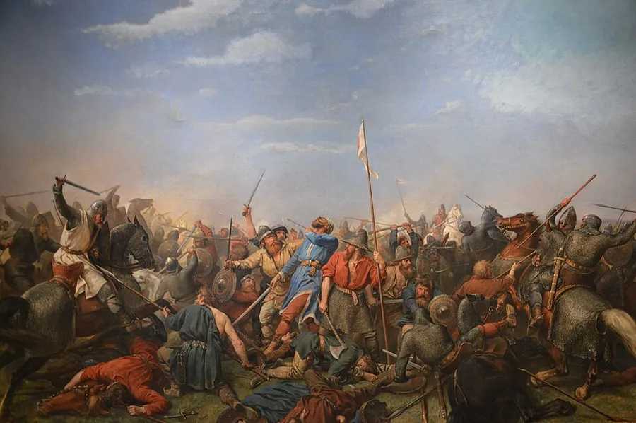Peter Nicolai Arbo's 1870 battle painting: mounted and foot warriors clash in close combat on a plain under a stormy sky, shields, spears, and swords raised, a white banner on a pole at center, and fallen or wounded fighters in the foreground.