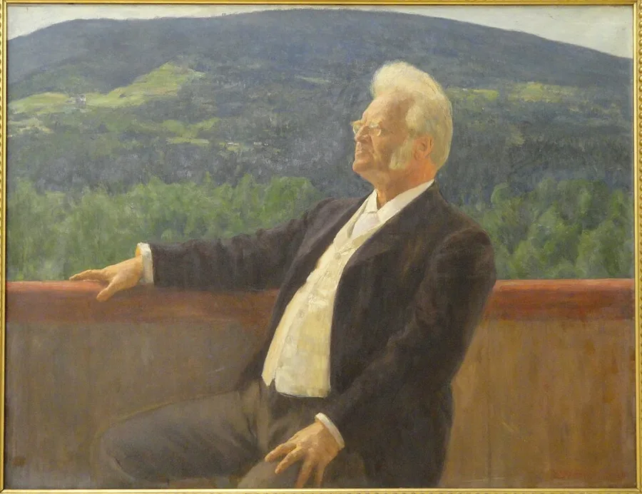 Painted portrait of an elderly Bjørnstjerne Bjørnson, white-haired and bearded with wire glasses, seated on an outdoor balcony railing gazing off to the side, forested hills visible behind him.
