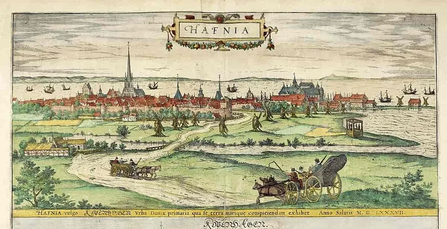 Hand-colored 16th-century bird's-eye engraving of Copenhagen labeled 'HAFNIA,' seen from Vesterbro hill with the walled city's spires and harbor beyond, and horse-drawn carriages on a country road in the foreground.