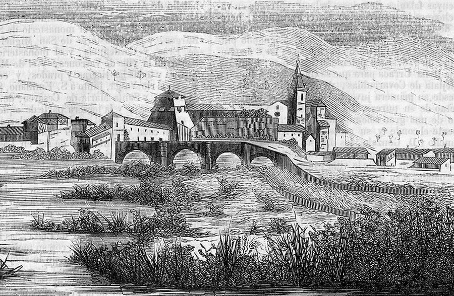 An 1847 wood engraving of Covarrubias seen from across the river — the stone bridge's arches, the collegiate-church tower over the town's rooftops, and bare hills behind, with faint show-through from the printed page.