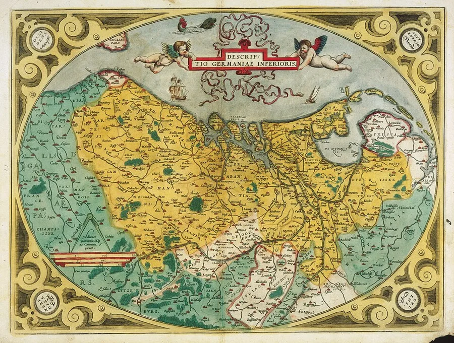 Abraham Ortelius's 1573 hand-colored map "Descriptio Germaniae Inferioris," an oval map of the seventeen Low Countries provinces bordered by an ornate strapwork frame with cherubs, ships, and a title cartouche.