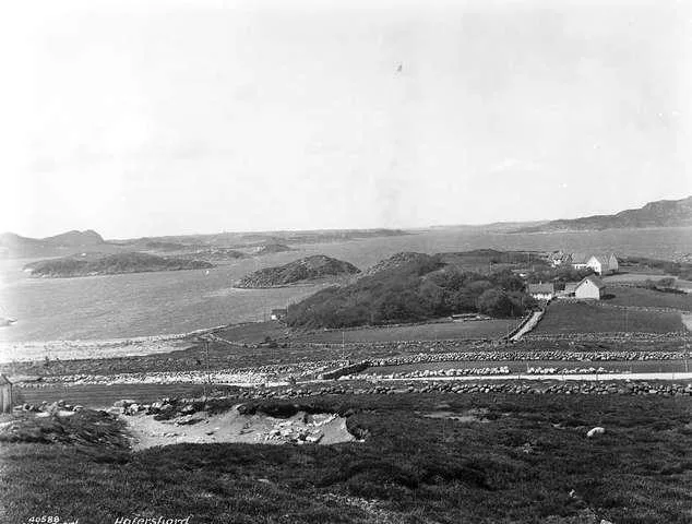 Anders Beer Wilse's 1934 photograph of Hafrsfjord — the shallow fjord's calm water winding between low farmed shores and bare knolls southwest of Stavanger.