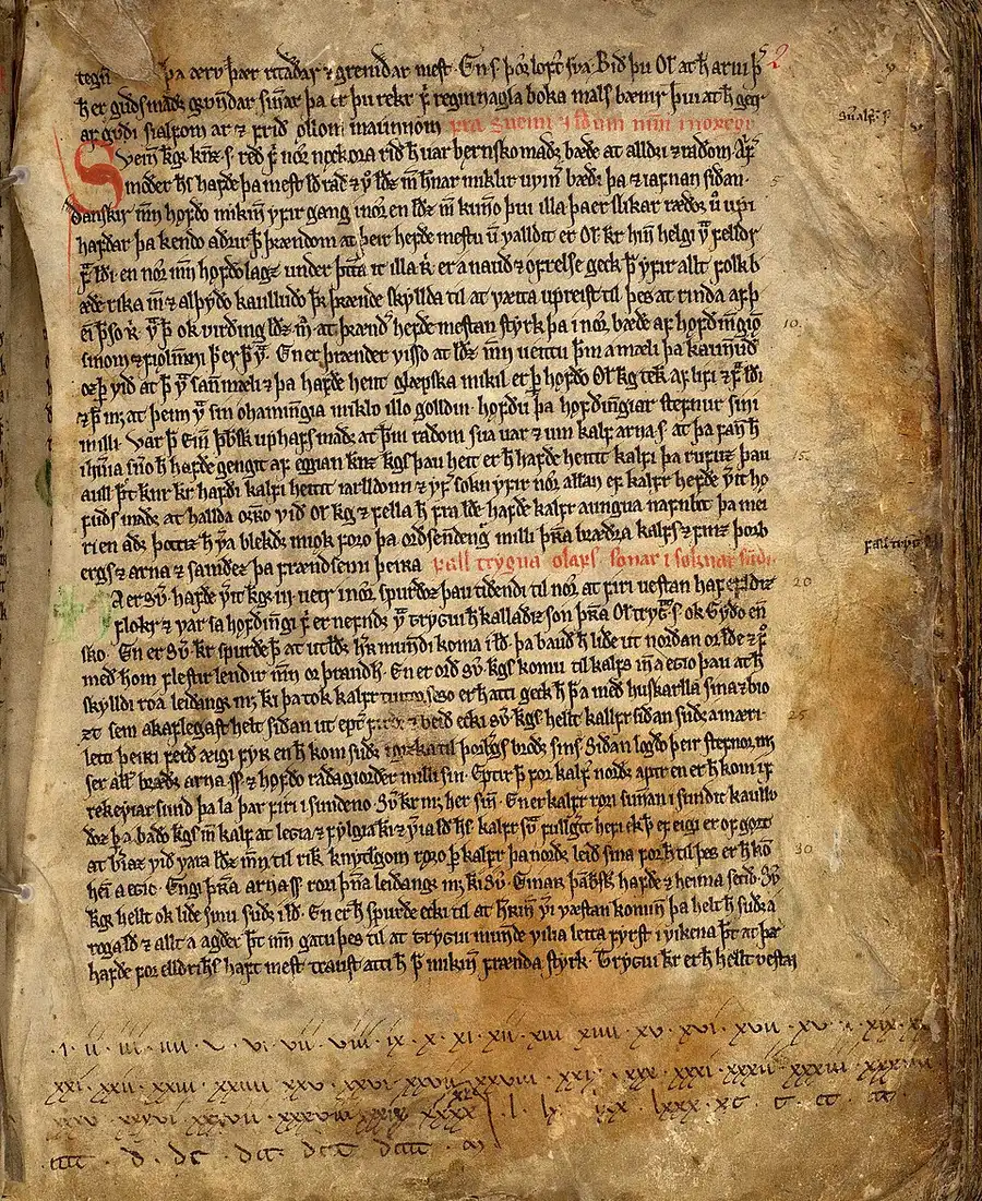 Photograph of a vellum manuscript page: dense two-column Old Norse text in brown ink, a large red decorated initial letter, and marginal chapter numbers.