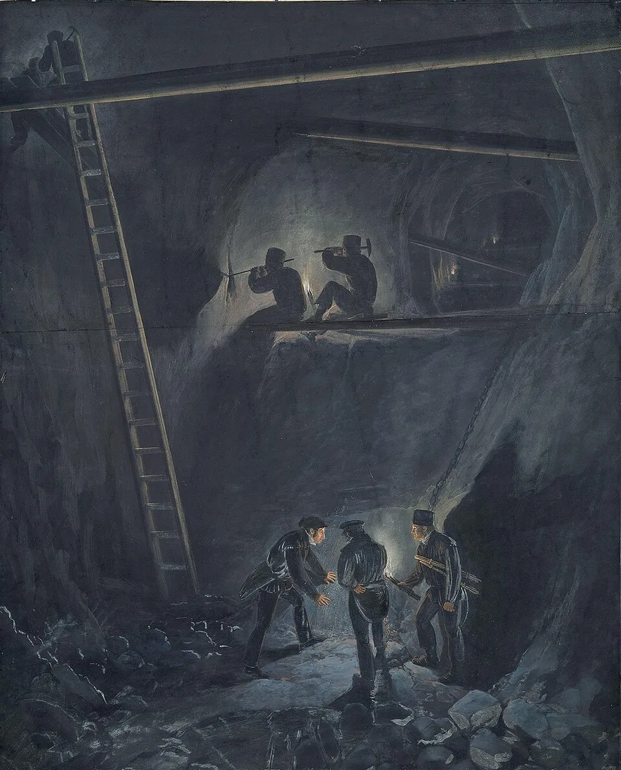Drawing of miners working by lantern and candlelight deep inside the Kongsberg silver mine, two wielding pickaxes on a wooden platform beneath rock-cut arches, a long ladder descending into the gallery, and three more miners with a lamp below.