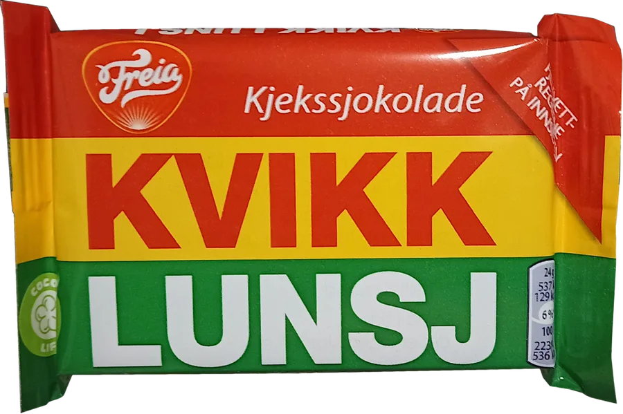 A Kvikk Lunsj wrapper photographed face-on: red Freia band, yellow KVIKK band, green LUNSJ band, showing the four wafer-and-chocolate fingers' packaging clearly against a plain background.