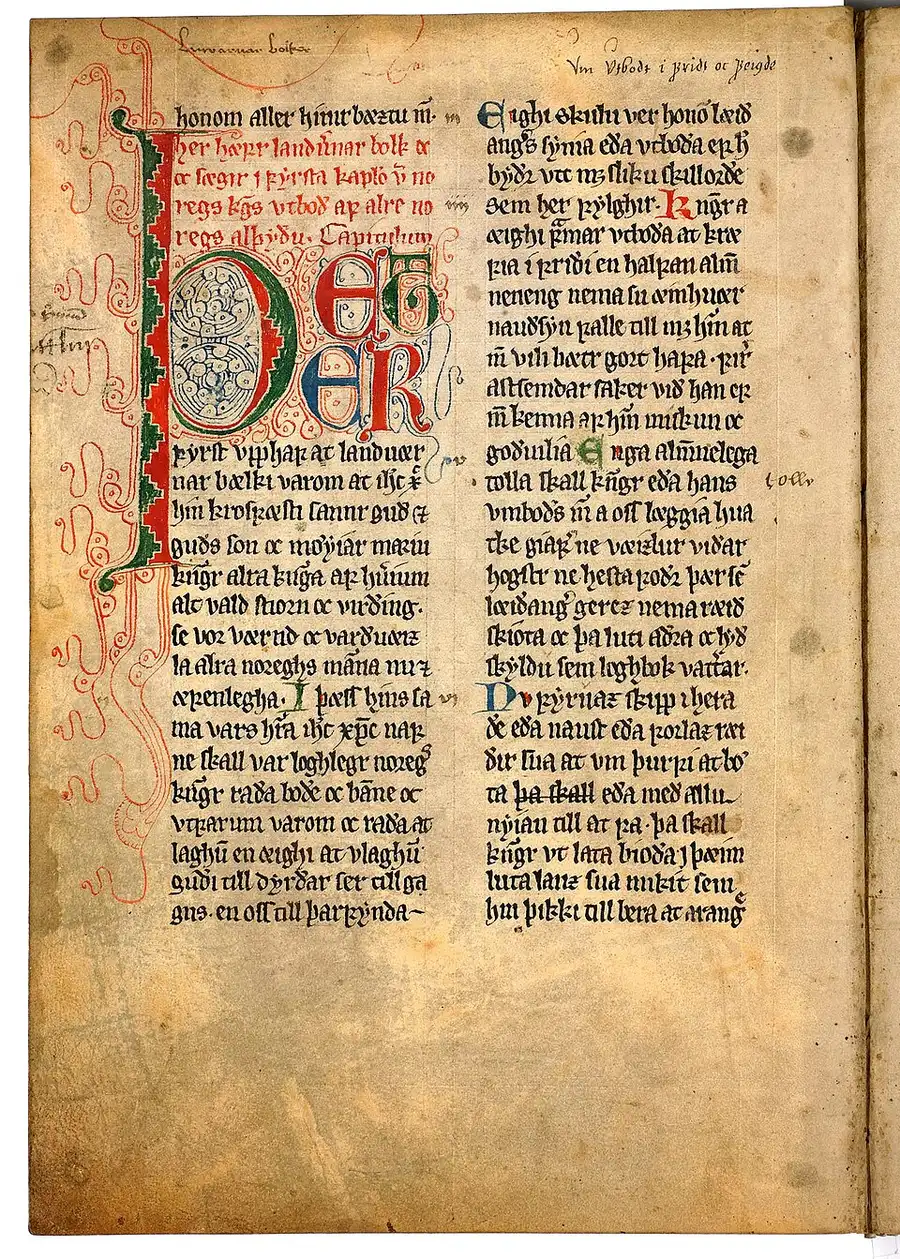 A page of Magnus Lagabøte's Landslov in a medieval copy — two columns of Old Norse book-hand opening the land-defence section, with a great interlace initial in red, green, and blue.