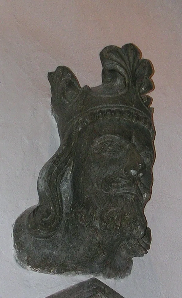 The thirteenth-century stone head of King Magnus VI Lagabøte in Stavanger Cathedral — a crowned royal face carved within living memory of the king, worn smooth by seven centuries.