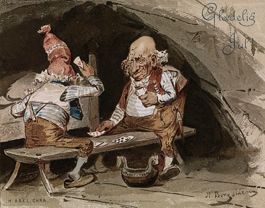 Nils Bergslien's 1887 Christmas card Glædelig Jul — one red-capped nisse and a bareheaded companion with white side-tufts play cards on a barn bench, a horse-head-handled ale bowl on the floor, "Glædelig Jul!" in blue script above.