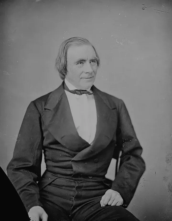 A Mathew Brady studio photograph of Ole Bull from his American touring years — the violinist seated in formal dress, silver-haired.