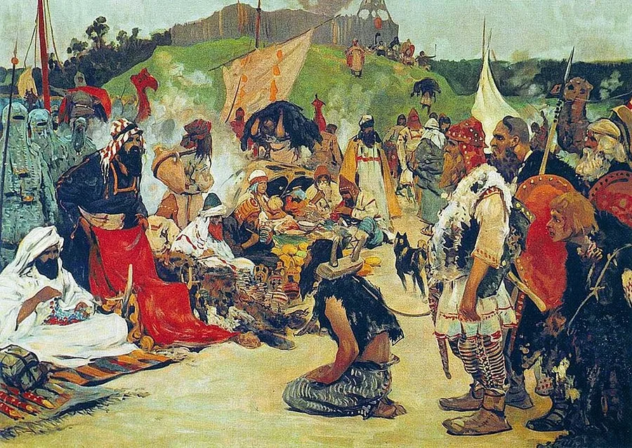 Ivanov's painting of a riverside market: robed and turbaned merchants from the Islamic south sit by their wares while fur-clad Rus traders stand opposite, spears in hand; between them a bound captive kneels on the sand among the spread-out goods.
