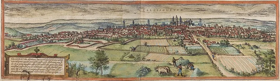 A hand-colored panoramic engraving labeled 'VALLISOLETVM,' showing Valladolid's church towers rising above its rooftops beyond fields with farm workers and grazing animals in the foreground.