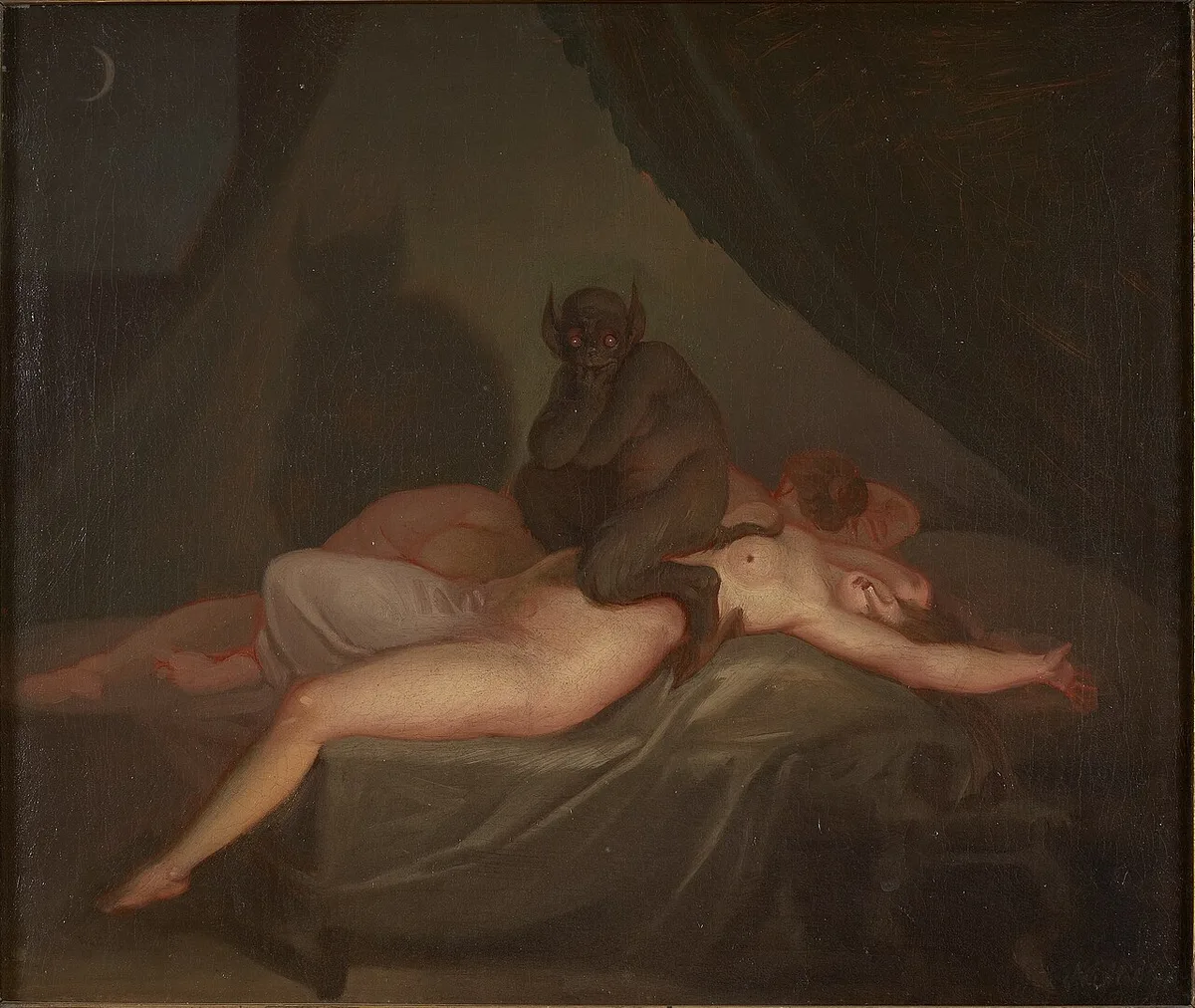 Nicolai Abildgaard's Nightmare — a dark, red-eyed mara squats on a sleeping woman sprawled across the bed, one arm flung wide, a second sleeper behind her and a crescent moon in the dark window.